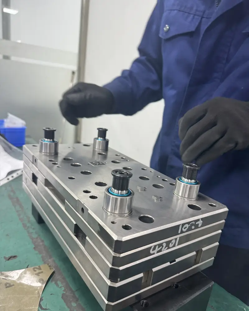 Sundi MFG technician assembling a precision metal stamping die 2q