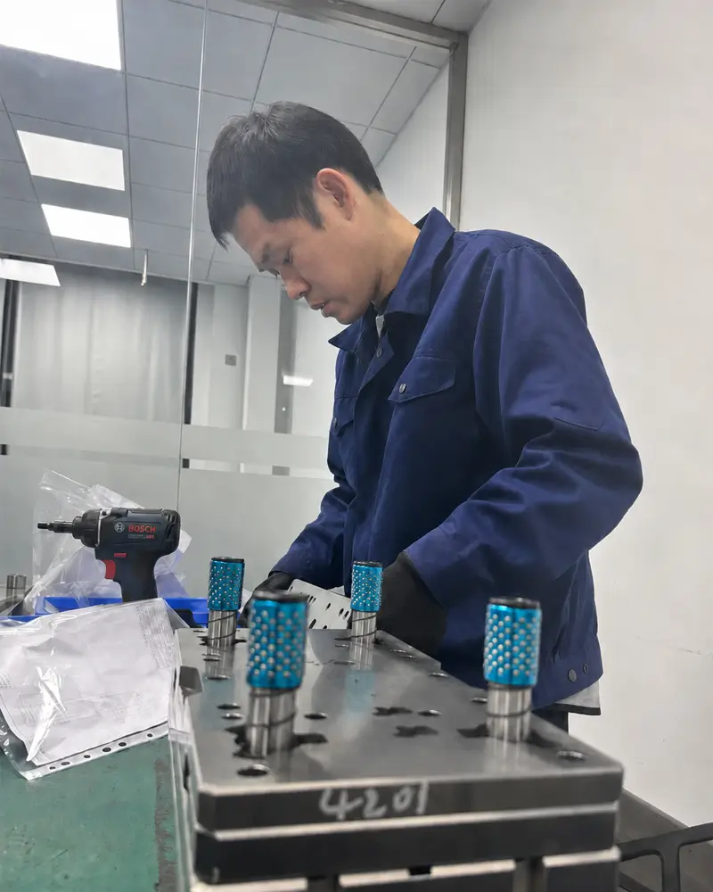 Sundi MFG technician assembling a precision metal stamping die